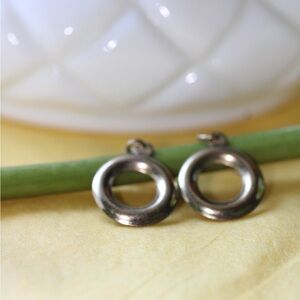 Stud earrings with a dangly loop